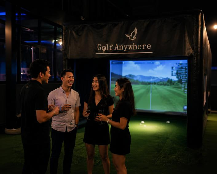 Guests enjoying Golf Anywhere at a corporate event